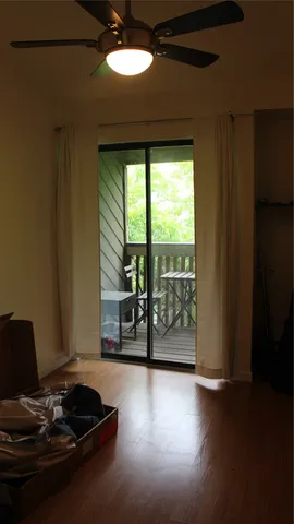 a table and chairs in a room next to a window