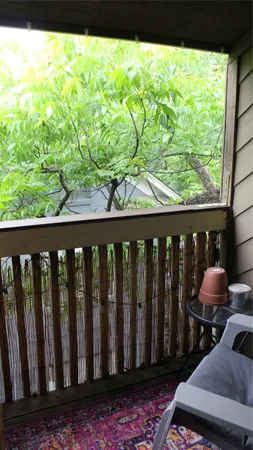 a wooden bench sitting in front of a building