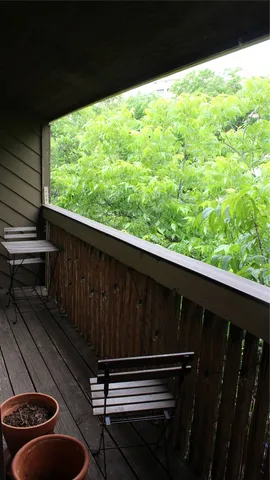 a balcony with wooden floor