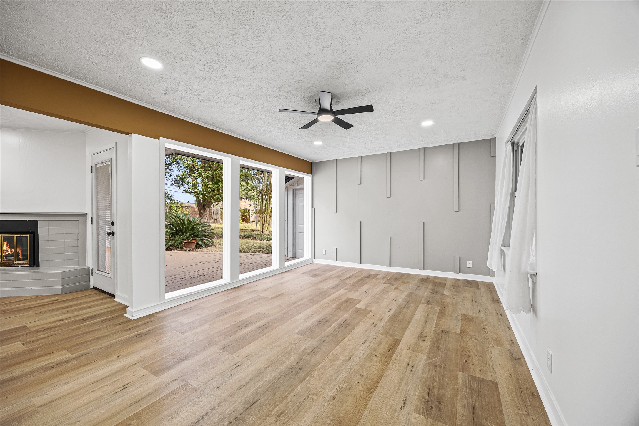 a view of an empty room with a fireplace
