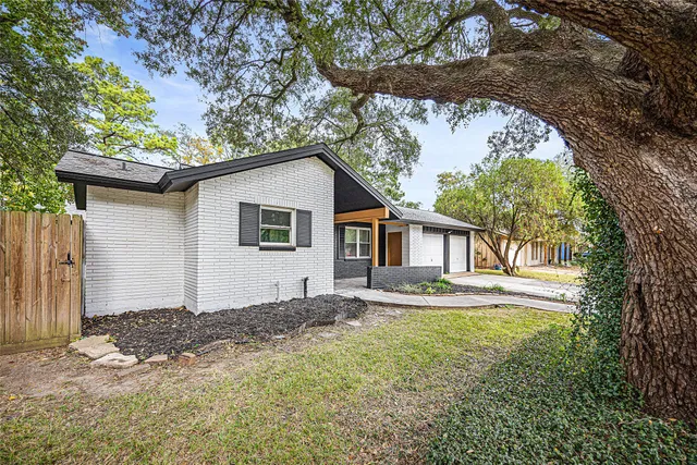a house with trees in the background