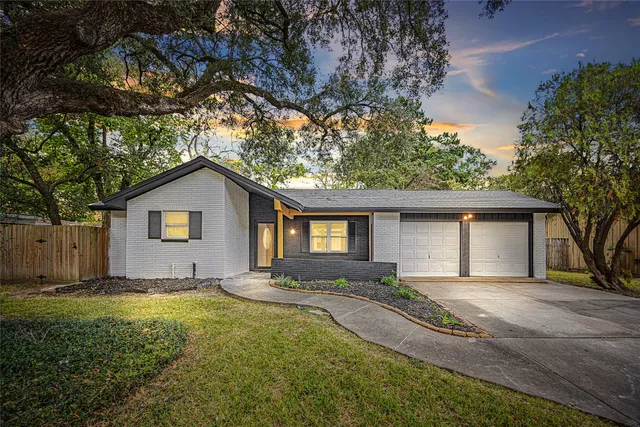 a house with trees in the background