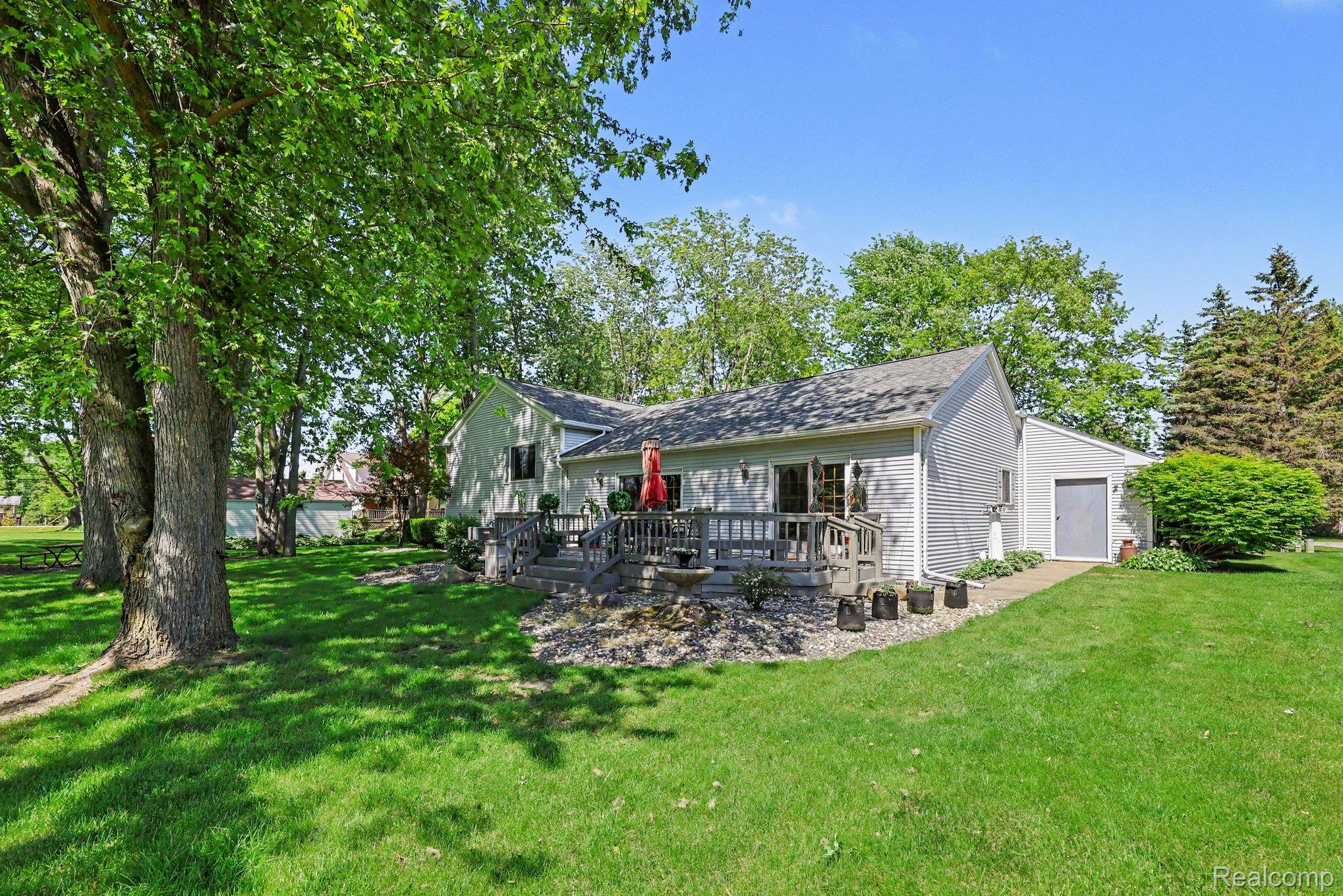 7020 Meldrum Road Fair Haven, MI 48023 - Photo 34 of 43 Expansive green lawn with mature trees