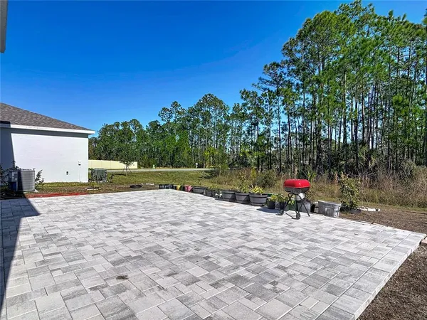 a view of a backyard of the house
