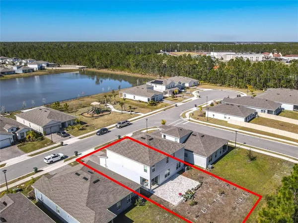 an aerial view of a city with ocean view