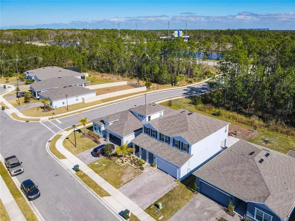 an aerial view of a house with a swimming pool