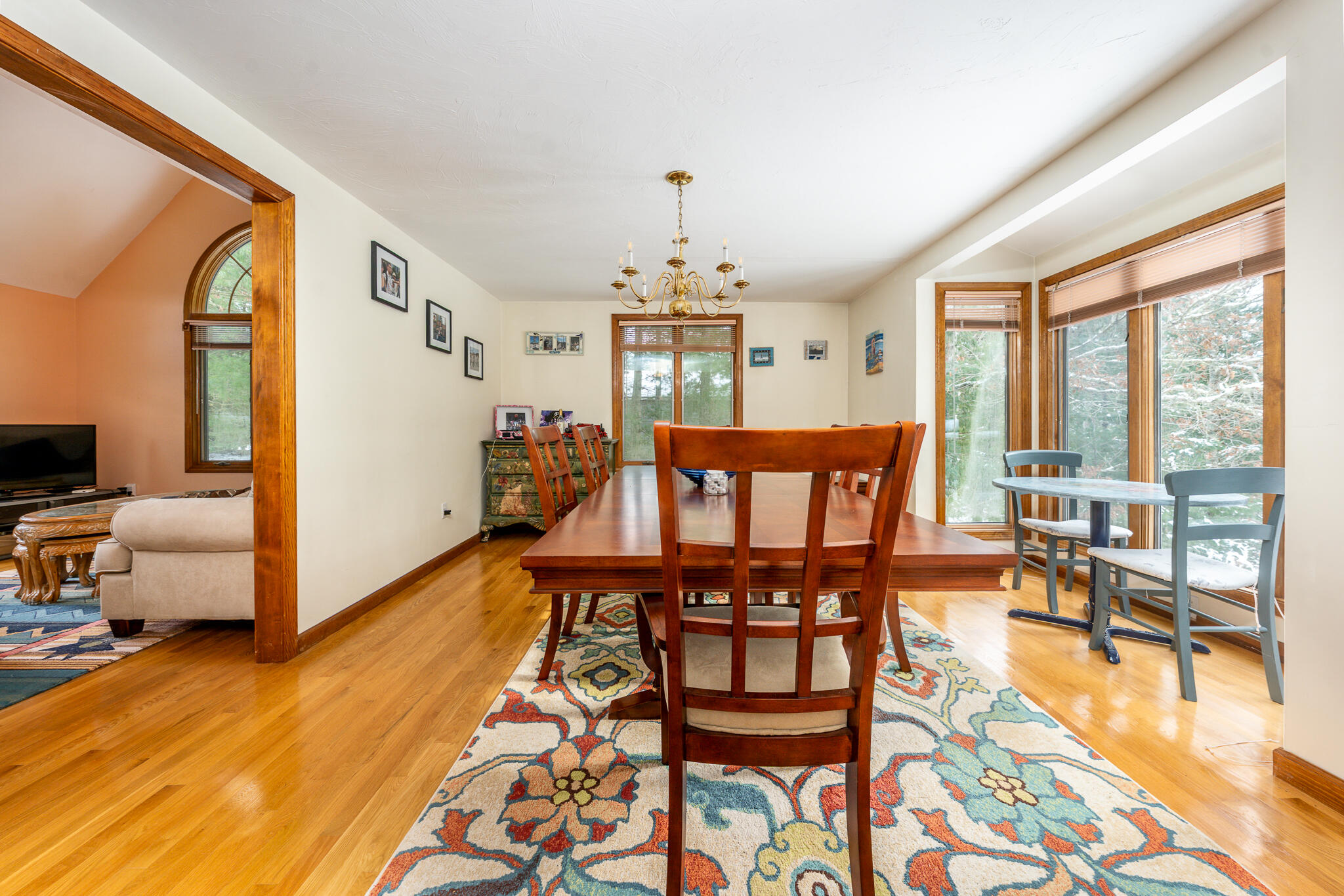 192 Sandy Valley Road Marstons Mills, MA 02648 - Photo 14 of 36 a dining room with furniture a chandelier and wooden floor