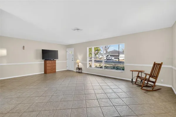 a view of workspace with furniture and window