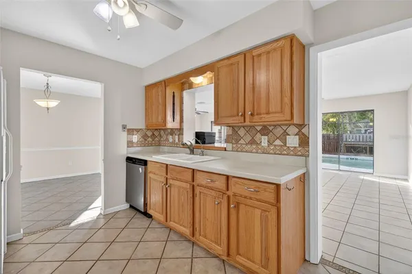 a kitchen with stainless steel appliances granite countertop a sink and a granite counter tops