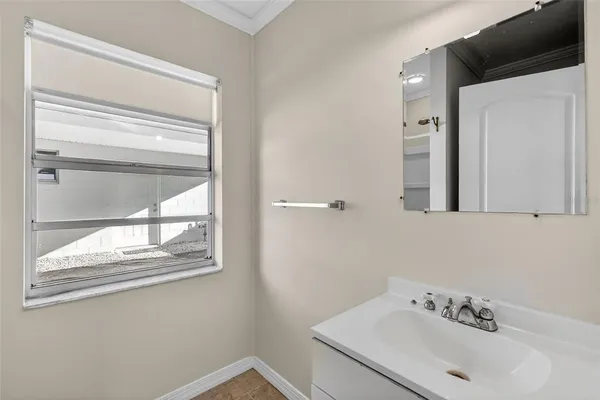 a bathroom with a sink and a mirror