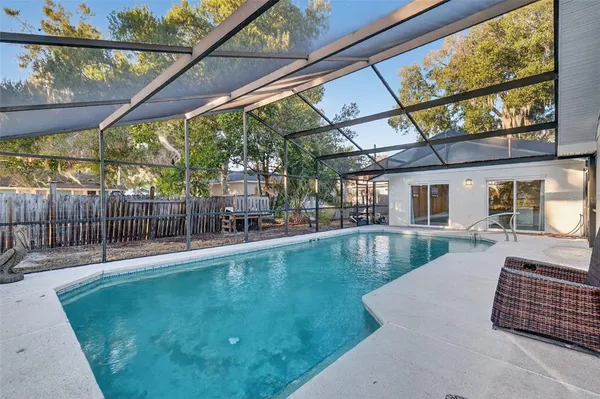 a view of pool with a patio
