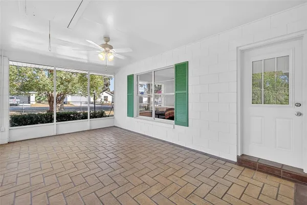 a view of an empty room with windows