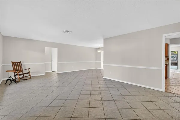 a view of an empty room with basketball court