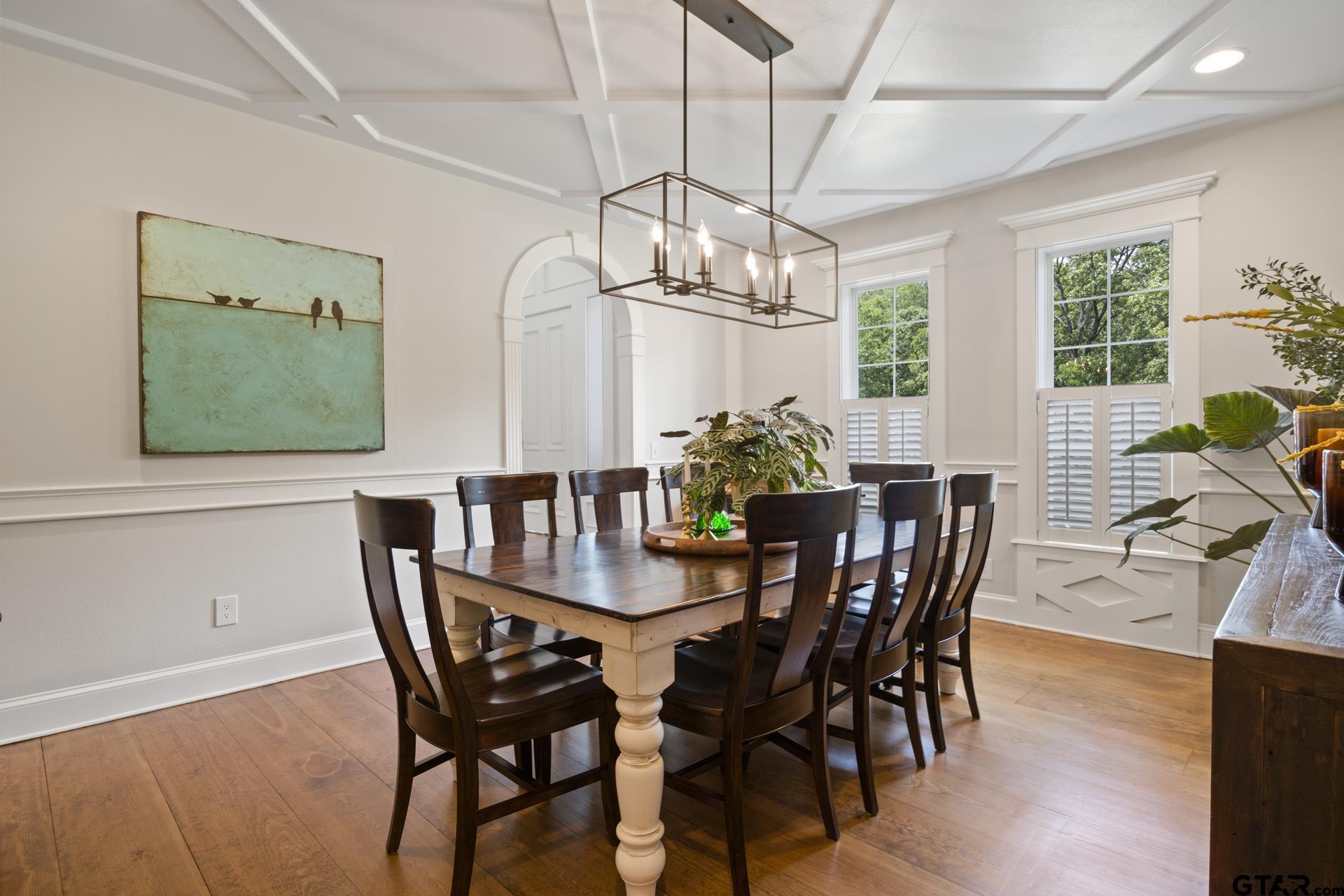 134 Private Road New Boston, TX 75570 - Photo 8 of 40 a view of a dining room with furniture a chandelier and wooden floor