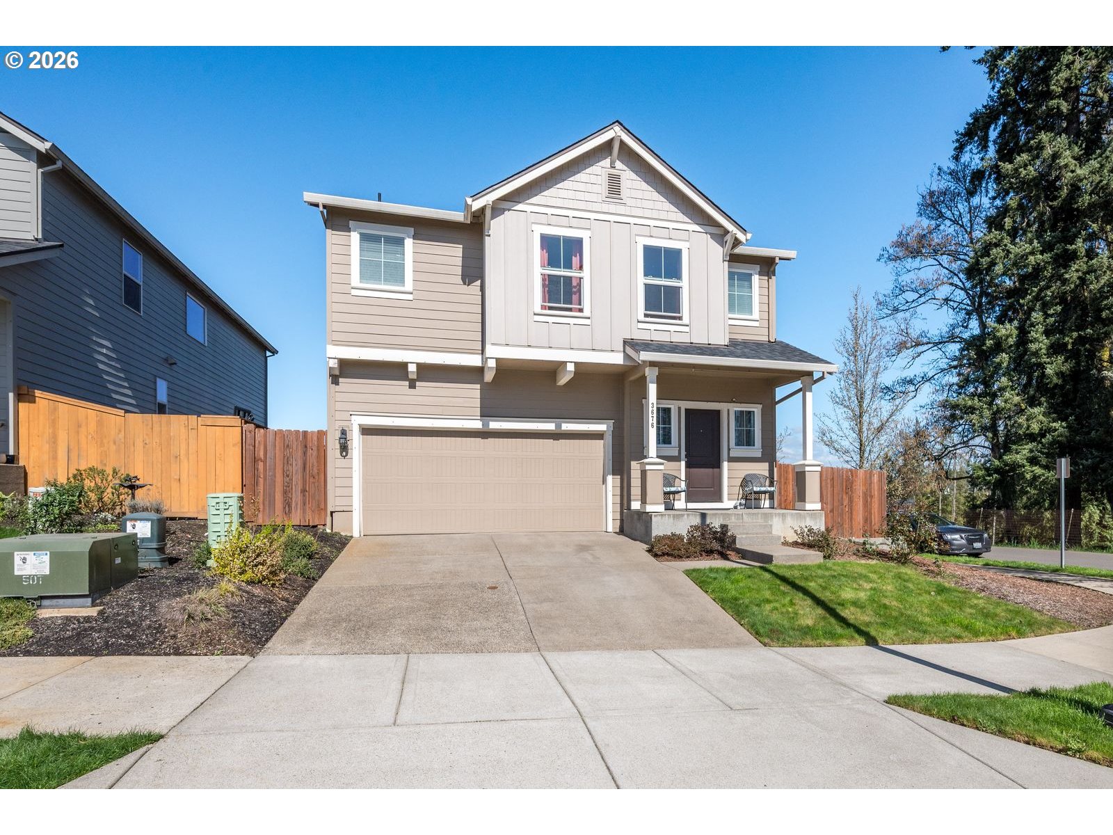 3676 North 10th Street Ridgefield, WA 98642 - Photo 1 of 37 a front view of a house with a yard and potted plants