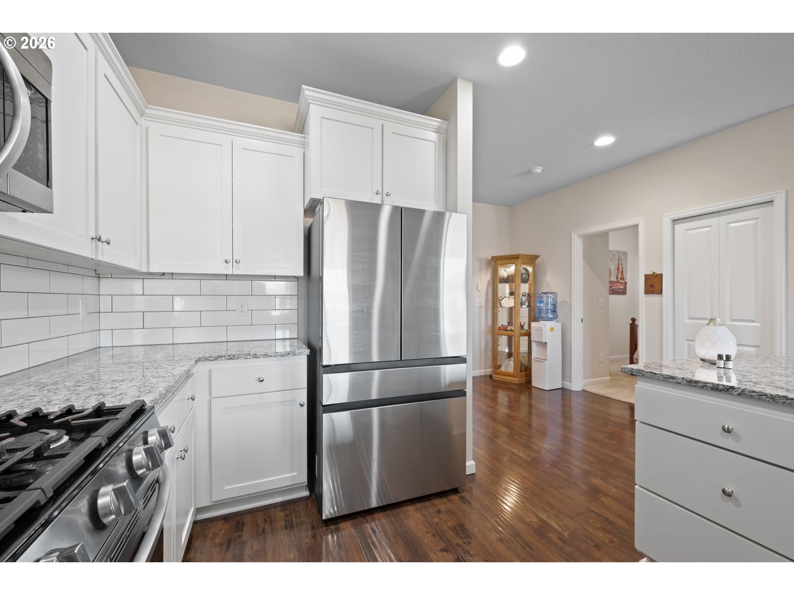 3676 North 10th Street Ridgefield, WA 98642 - Photo 12 of 37 a kitchen with a refrigerator and a stove top oven