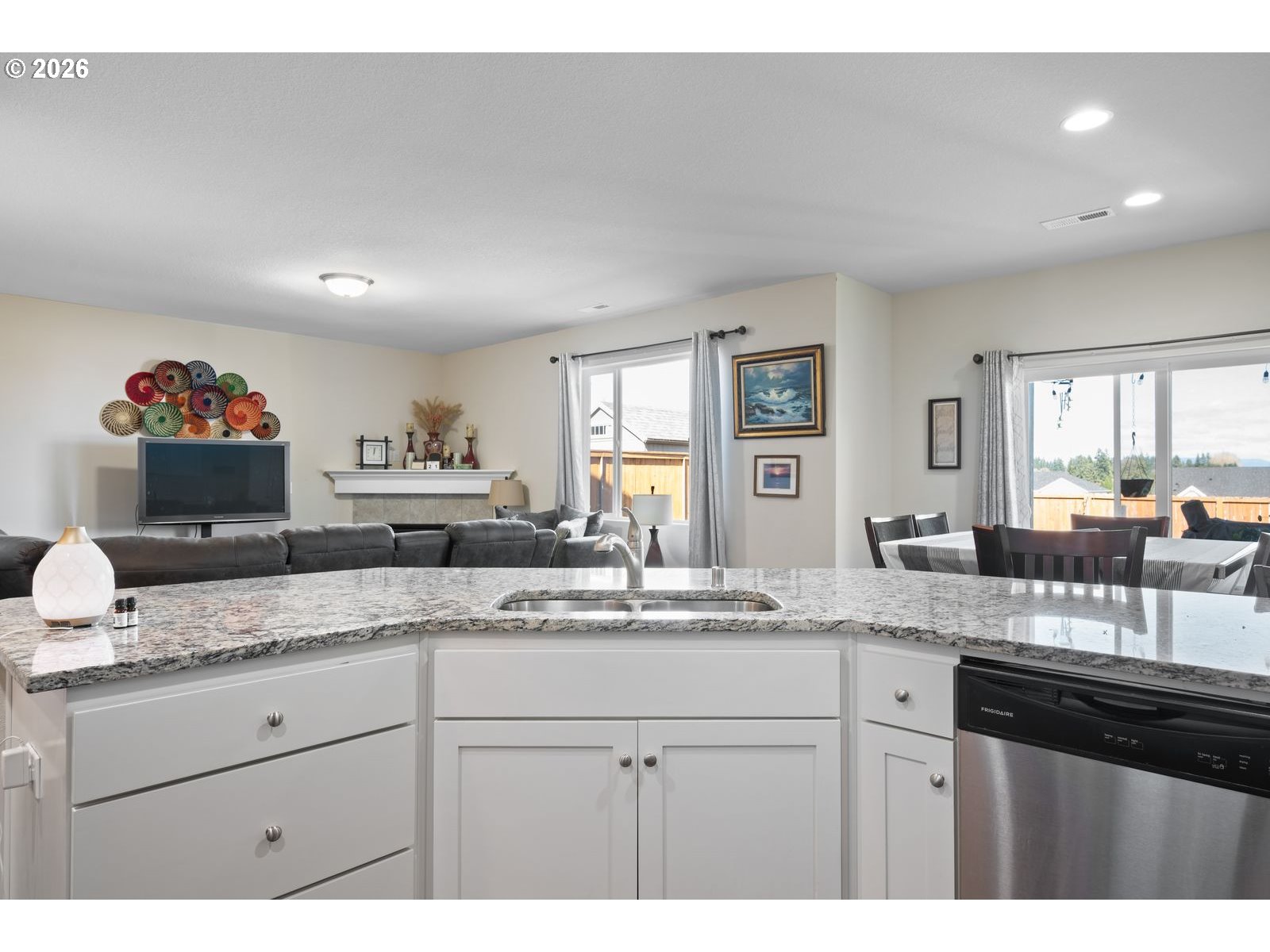 3676 North 10th Street Ridgefield, WA 98642 - Photo 14 of 37 a kitchen with granite countertop a sink and cabinets
