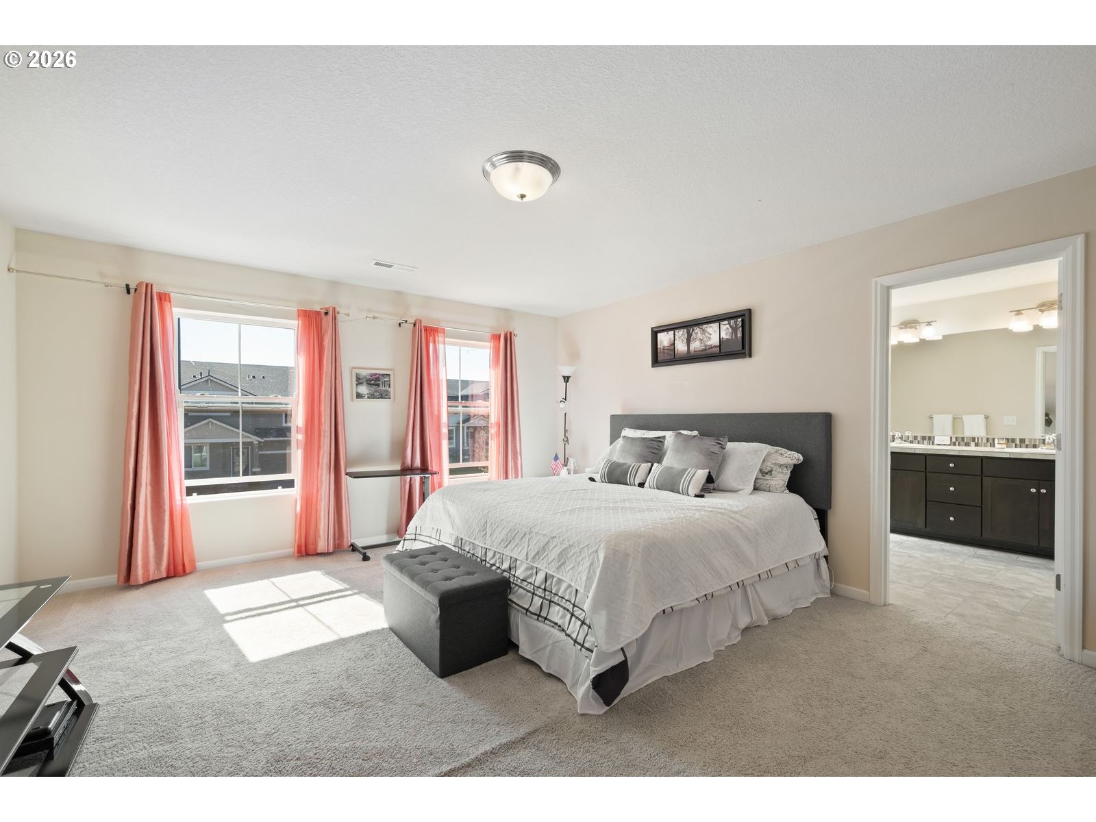 3676 North 10th Street Ridgefield, WA 98642 - Photo 19 of 37 a bedroom with a large bed and a large window