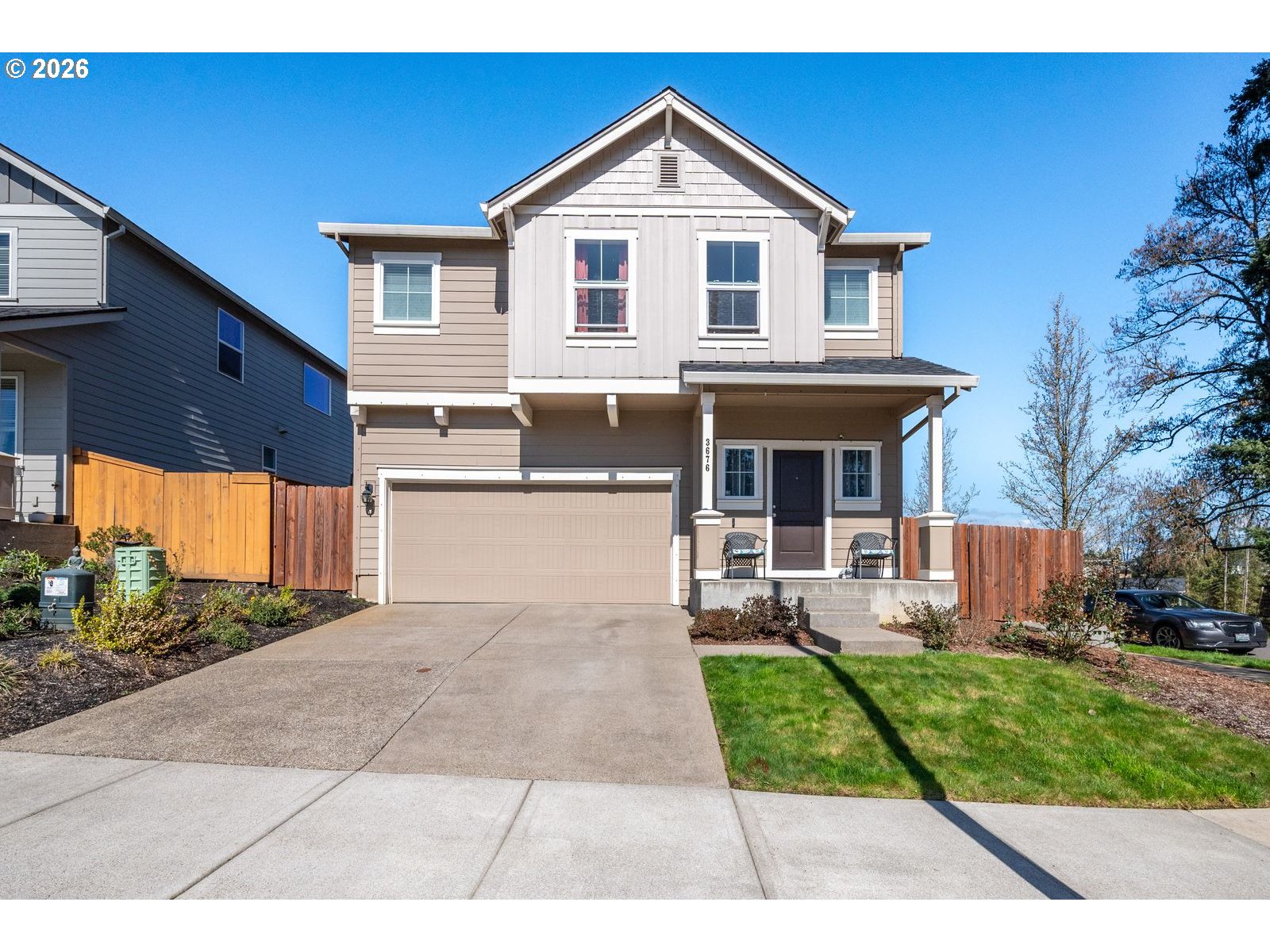 3676 North 10th Street Ridgefield, WA 98642 - Photo 2 of 37 a front view of a house with a yard and potted plants