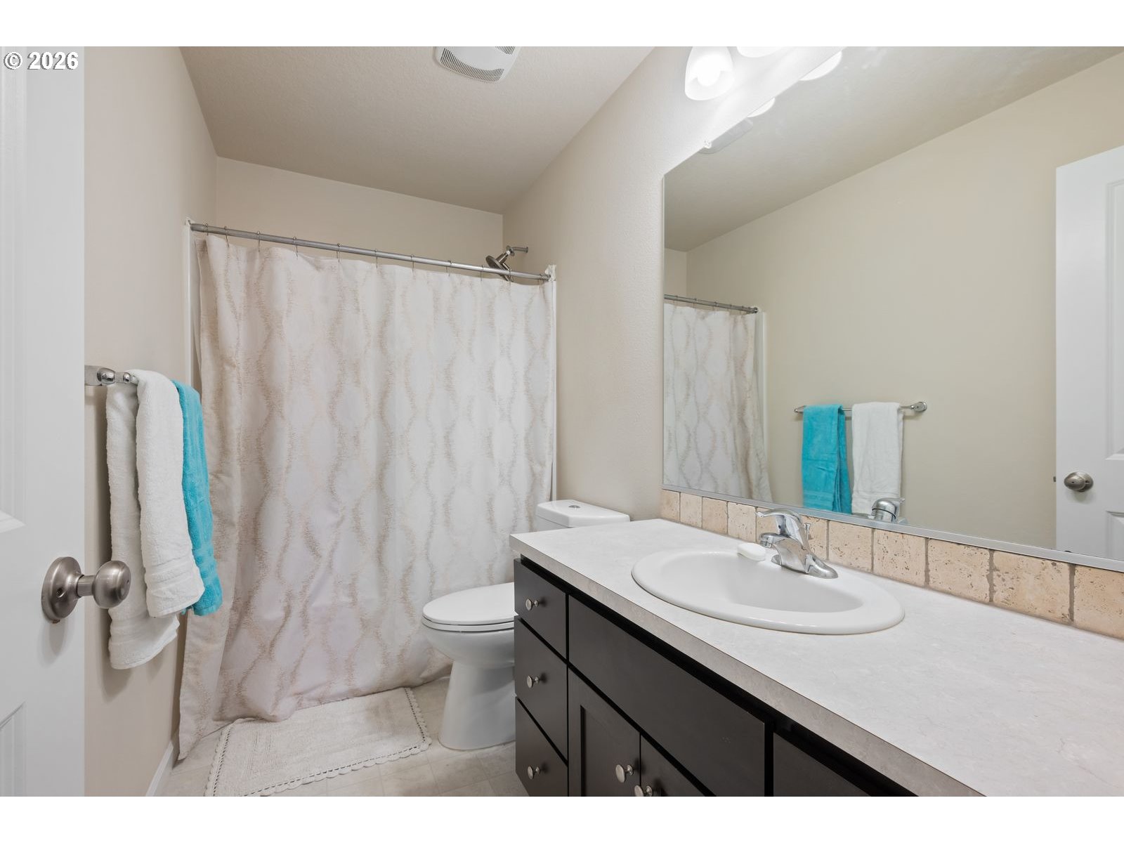 3676 North 10th Street Ridgefield, WA 98642 - Photo 25 of 37 a bathroom with a sink and a mirror