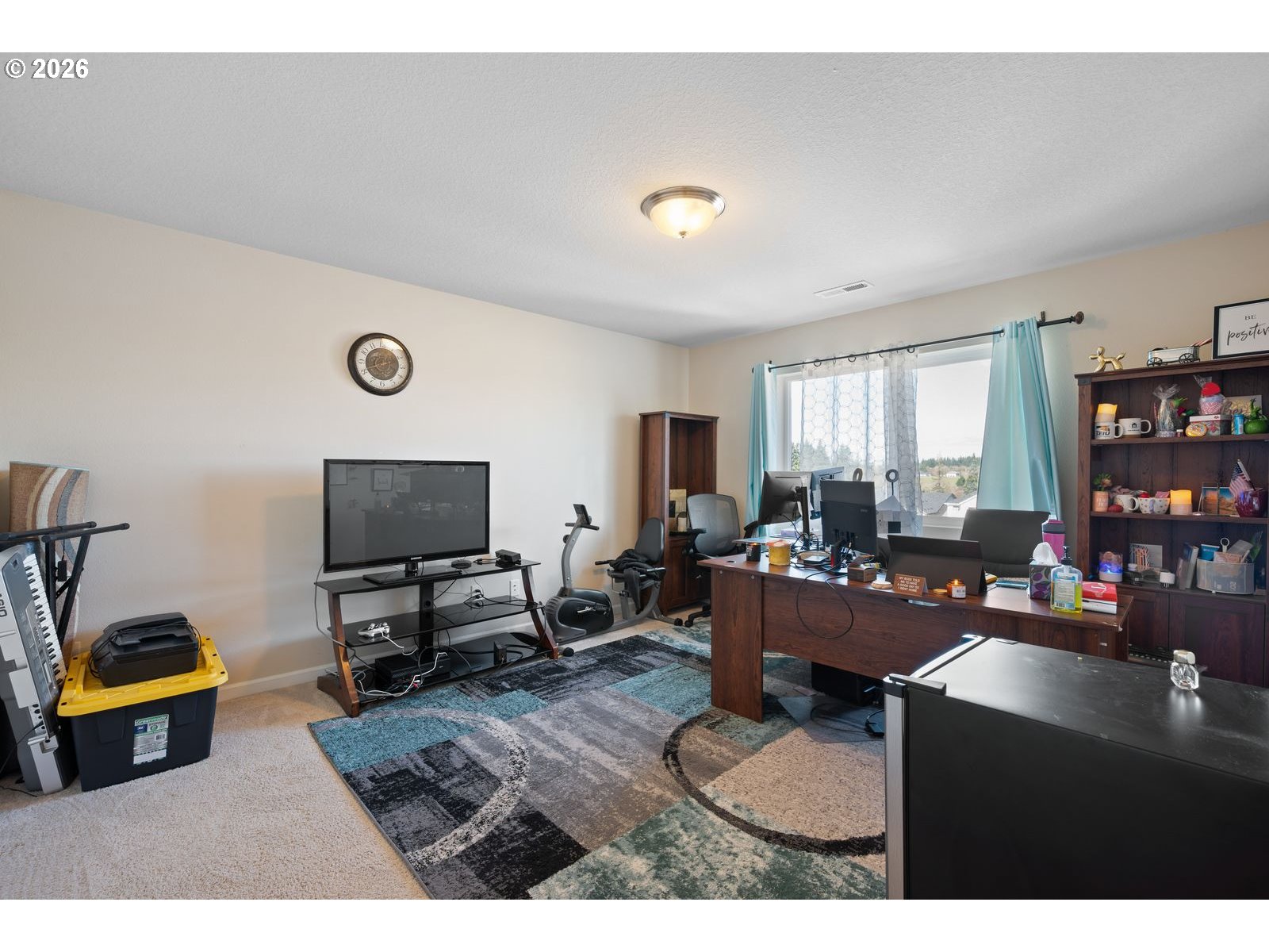 3676 North 10th Street Ridgefield, WA 98642 - Photo 26 of 37 a living room with furniture and a flat screen tv