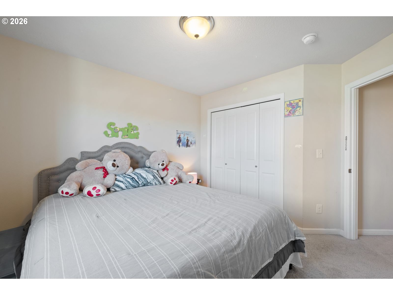 3676 North 10th Street Ridgefield, WA 98642 - Photo 31 of 37 a bedroom with a bed and chandelier