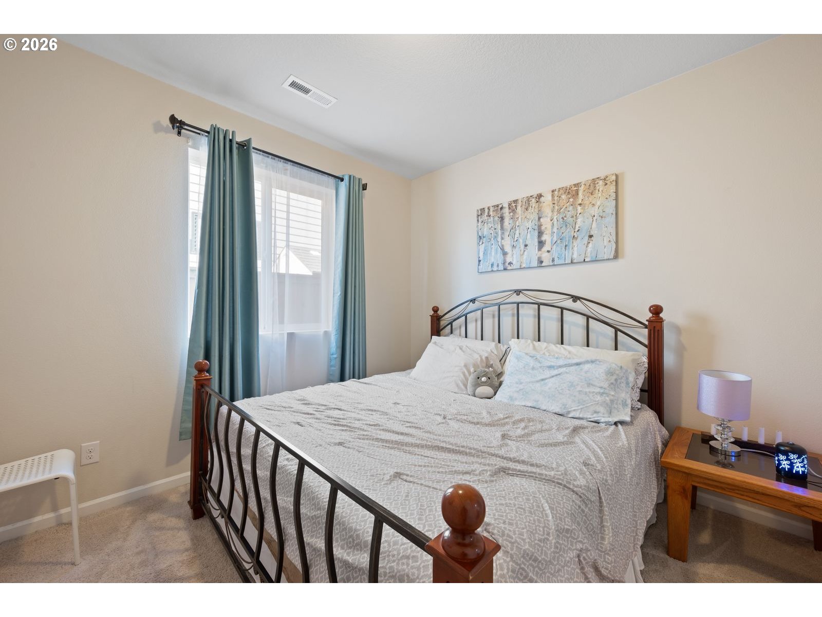 3676 North 10th Street Ridgefield, WA 98642 - Photo 32 of 37 a bedroom with a bed and a window