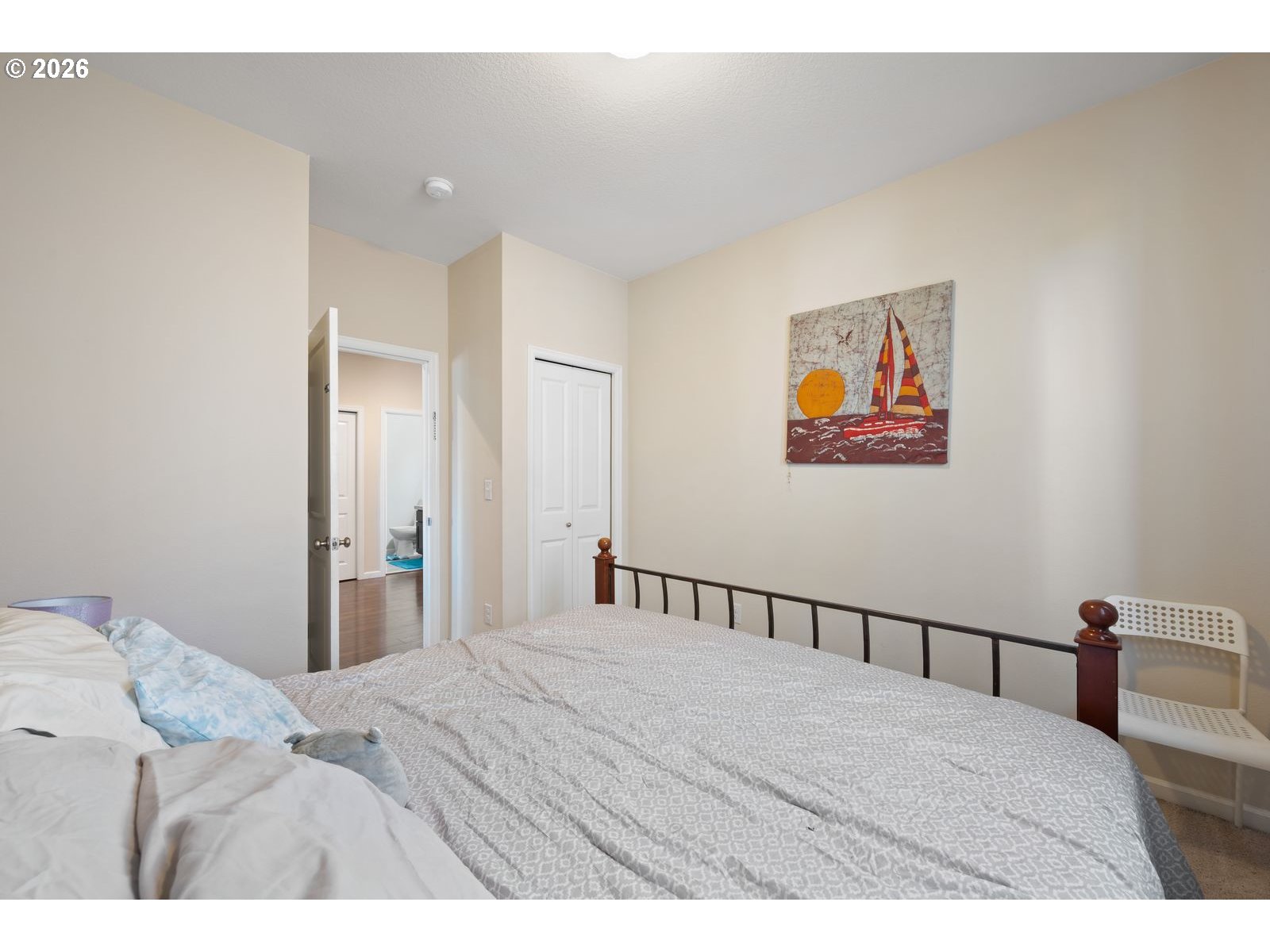 3676 North 10th Street Ridgefield, WA 98642 - Photo 33 of 37 a bedroom with a bed and a painting on the wall