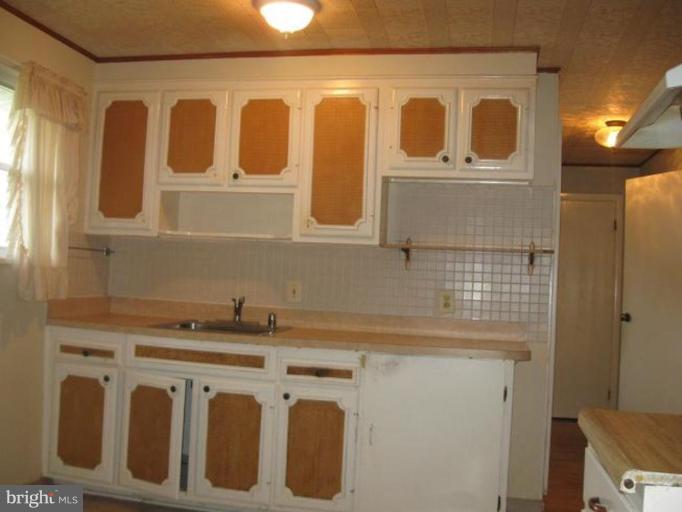 901 Laredo Road Silver Spring, MD 20901 - Photo 3 of 3 a utility room with a sink