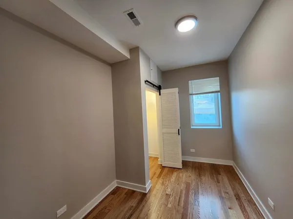 a bathroom with a double vanity sink and mirror