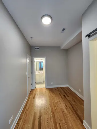 a bathroom with a toilet and a bath tub