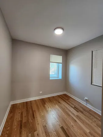 a bathroom with a sink and mirror with toilet