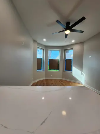 a kitchen with stainless steel appliances a sink a stove a refrigerator and cabinets