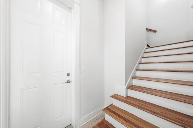 a view of staircase with white walls