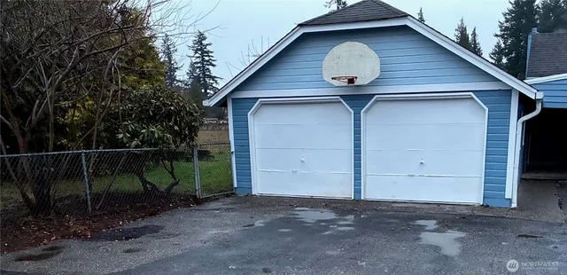 a view of a small house with a yard