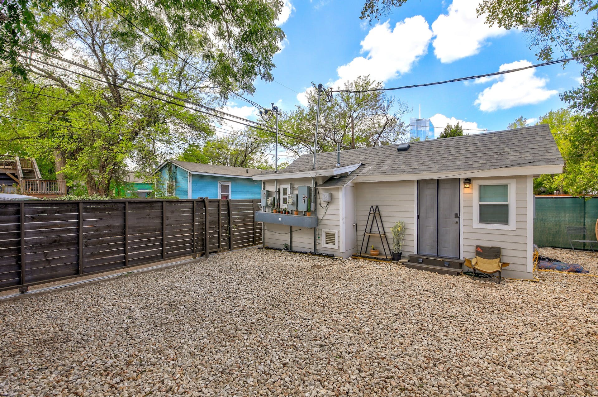1105 East 3rd Street Austin, TX 78702 - Photo 20 of 40 a view of a house with a large window and wooden fence