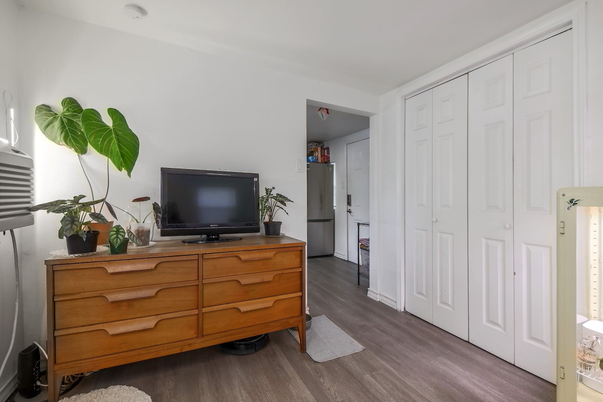 1105 East 3rd Street Austin, TX 78702 - Photo 27 of 40 a room with furniture and flat screen tv