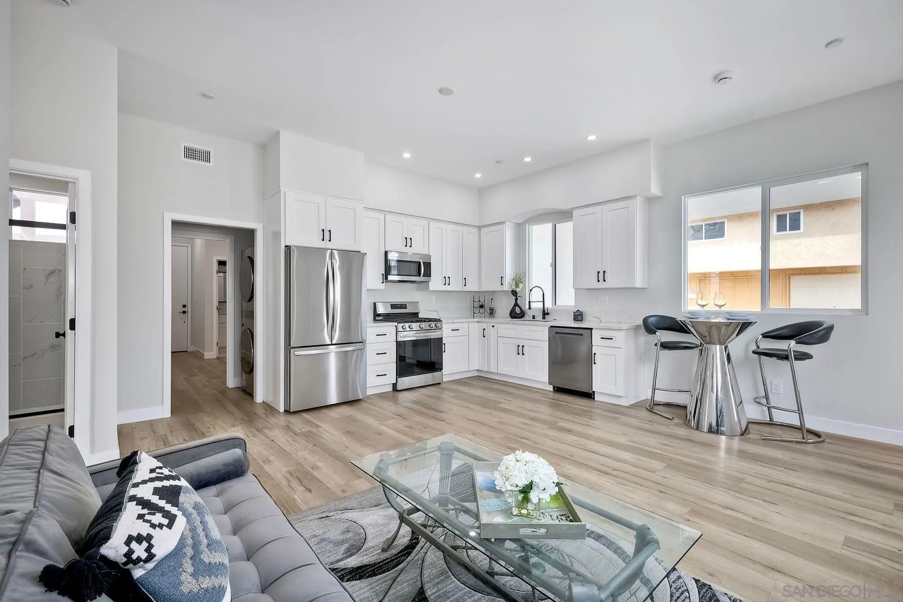 573 Florida Street Imperial Beach, CA 91932 - Photo 22 of 37 a kitchen with stainless steel appliances kitchen island granite countertop a refrigerator and a stove top oven