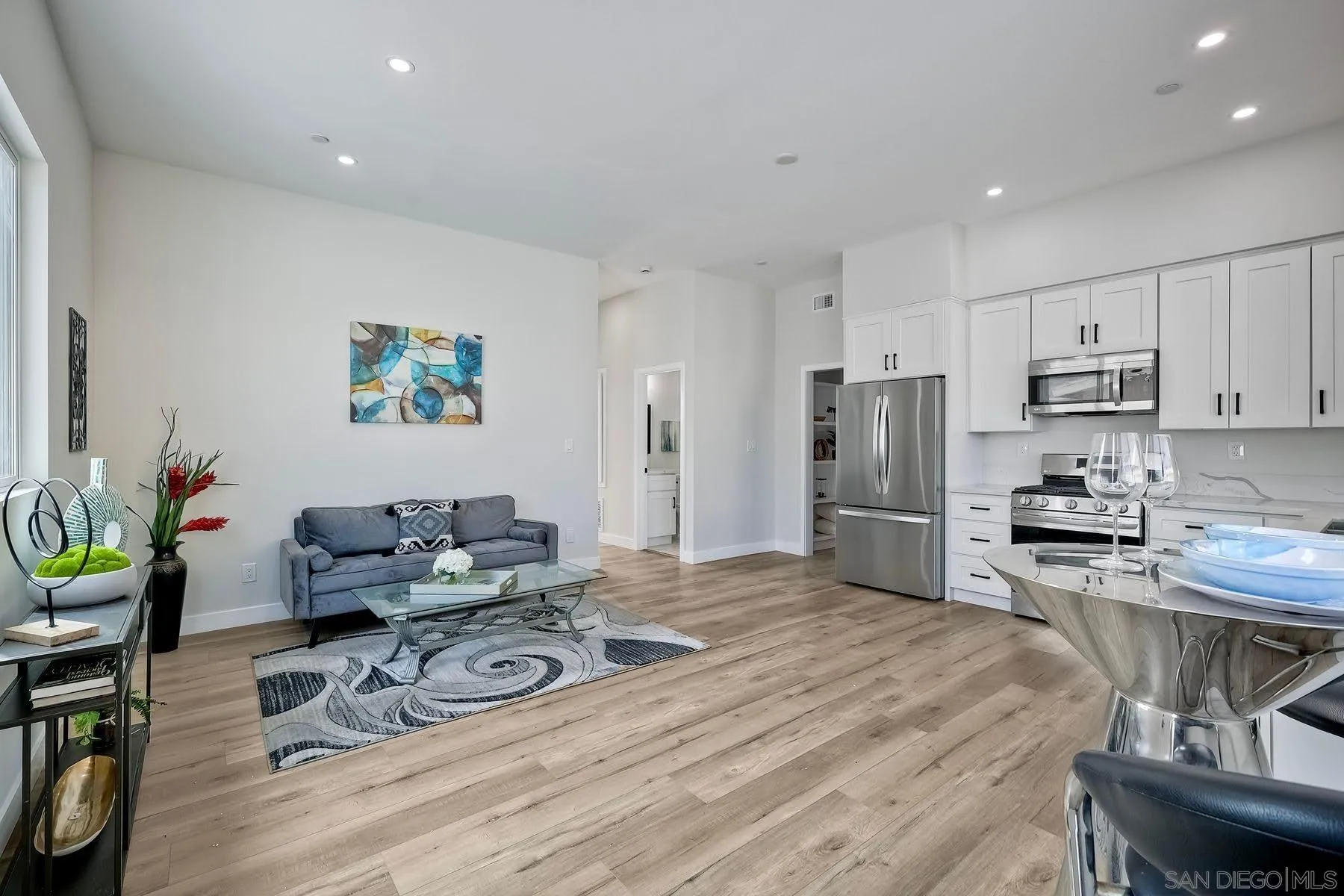 573 Florida Street Imperial Beach, CA 91932 - Photo 25 of 37 a kitchen with stainless steel appliances granite countertop a sink stove and refrigerator
