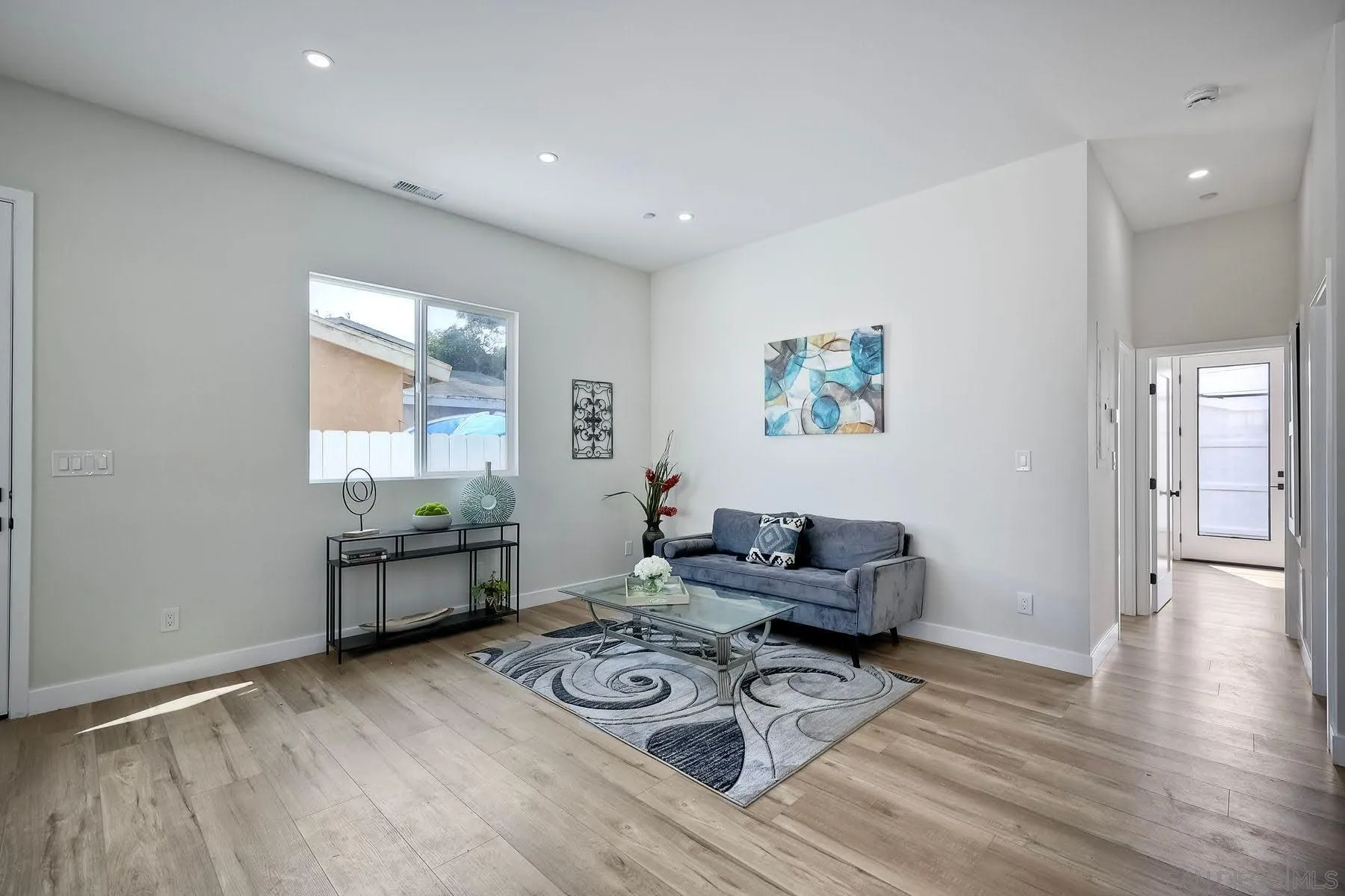 573 Florida Street Imperial Beach, CA 91932 - Photo 26 of 37 a living room with furniture and wooden floor