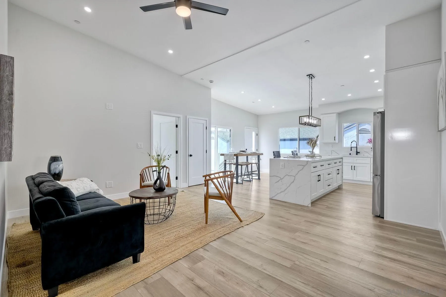 573 Florida Street Imperial Beach, CA 91932 - Photo 7 of 37 a living room with furniture and kitchen view