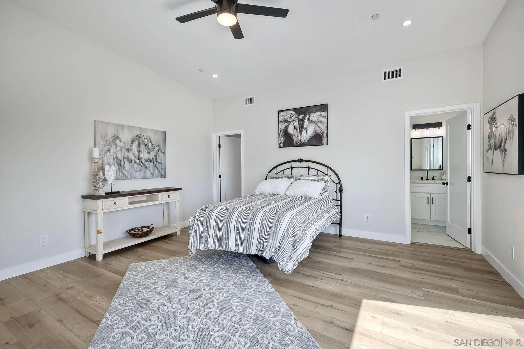 573 Florida Street Imperial Beach, CA 91932 - Photo 8 of 37 a bedroom with a bed and a painting on the wall