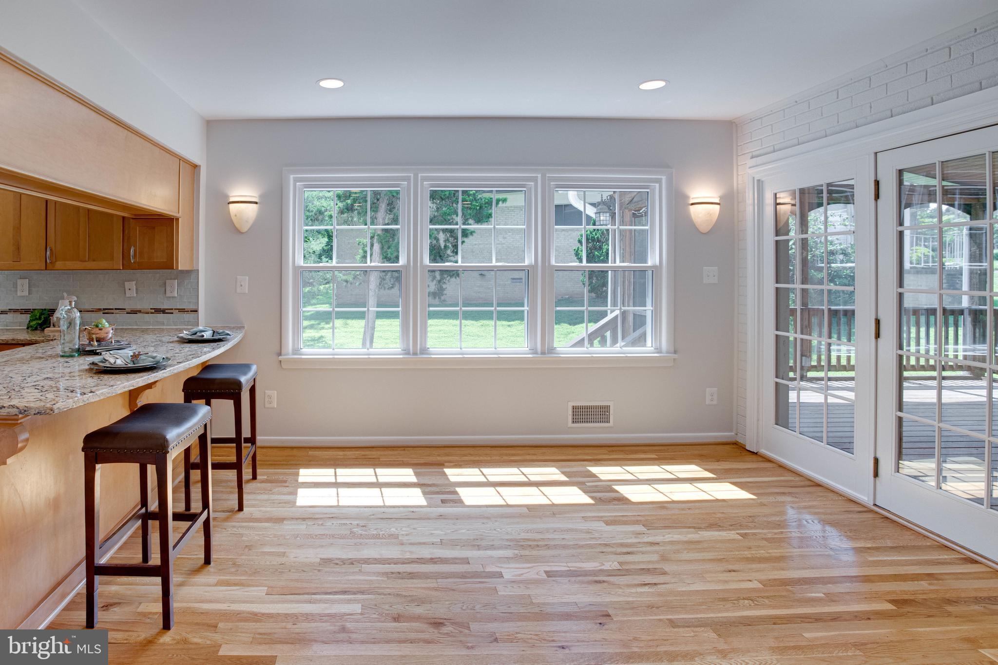 8103 Falstaff Road McLean, VA 22102 - Photo 14 of 44 Sun-Drenched Kitchen Opens to the Family Room