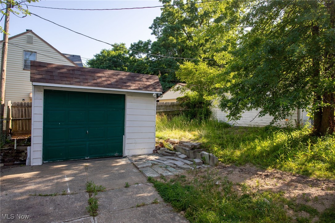 12028 Triskett Road Cleveland, OH 44111 - Photo 4 of 23 Detached garage featuring concrete driveway