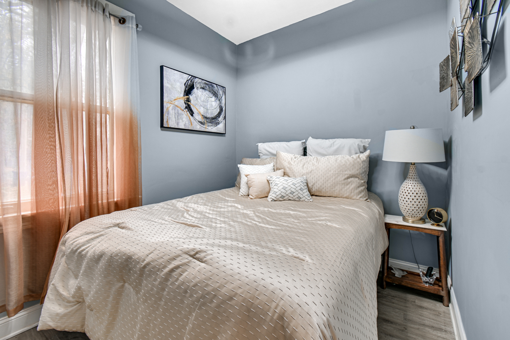 11548 South Normal Avenue Chicago, IL 60628 - Photo 16 of 21 a bedroom with a bed and wooden floor