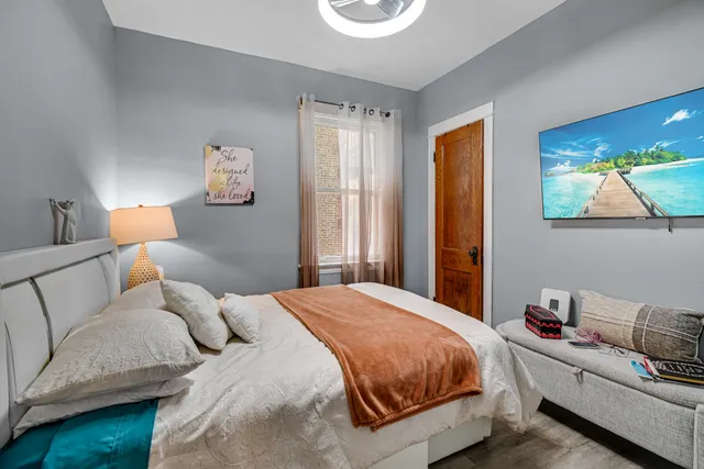 a bedroom with a bed and a couch