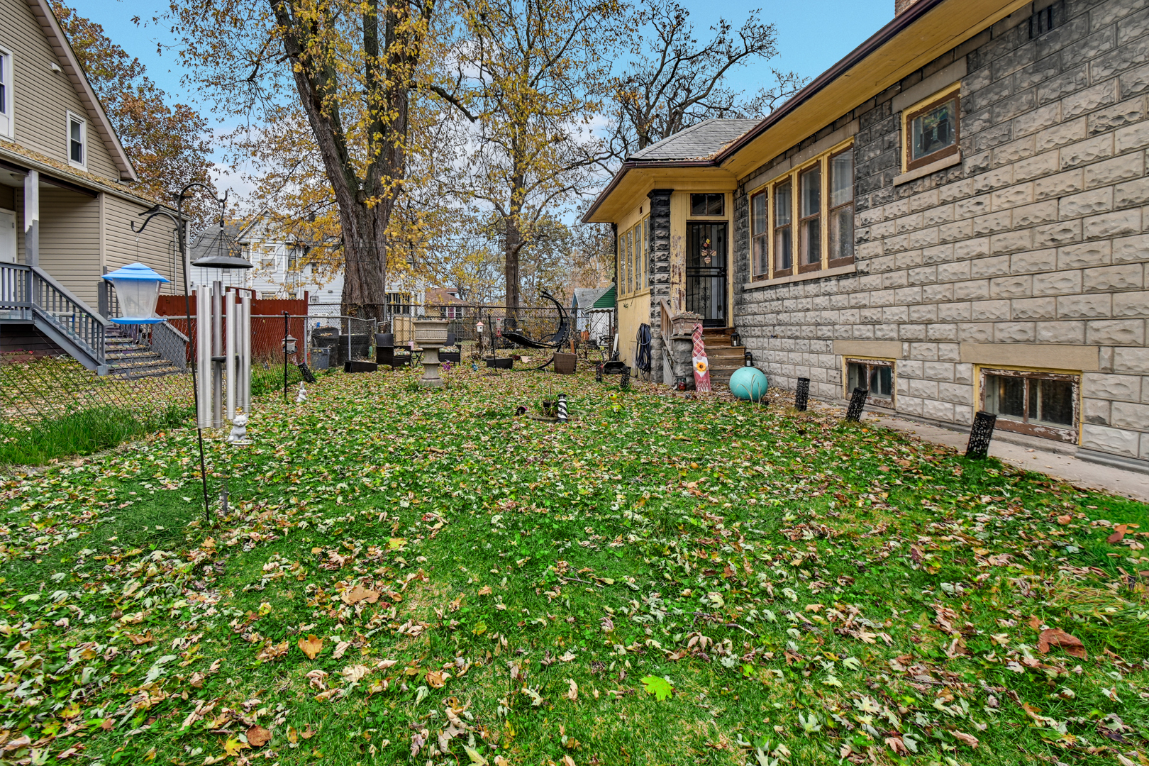 11548 South Normal Avenue Chicago, IL 60628 - Photo 5 of 21 a view of a house with a yard