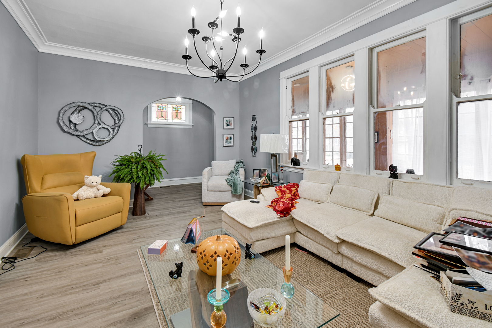 11548 South Normal Avenue Chicago, IL 60628 - Photo 10 of 21 a living room with furniture and a chandelier