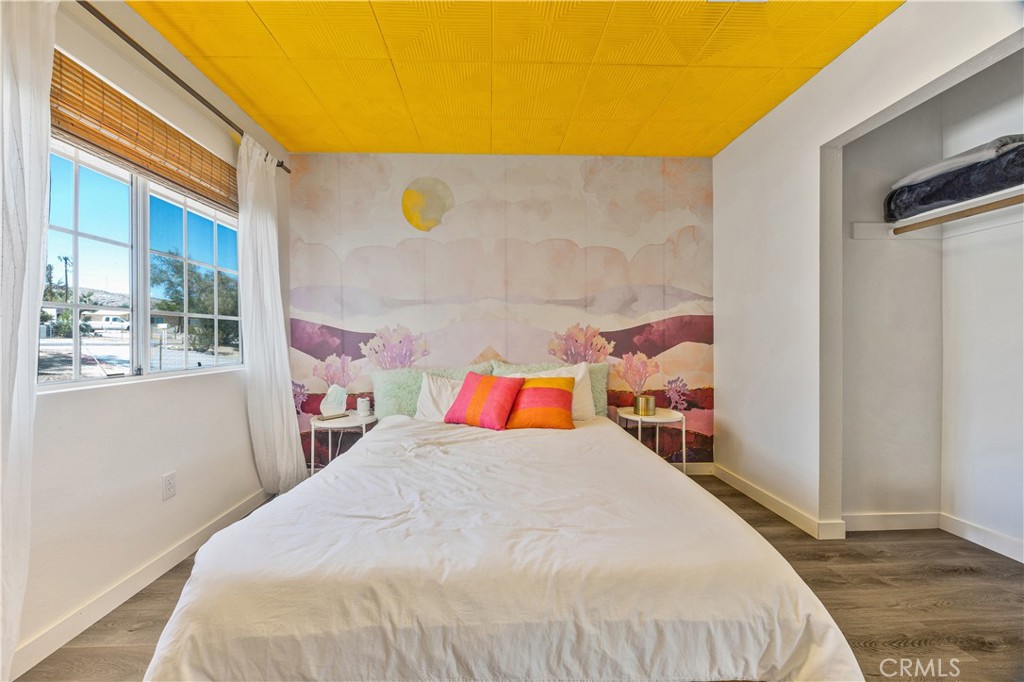 6123 Scenic Drive Joshua Tree, CA 92252 - Photo 18 of 30 a bed sitting in a bedroom next to a window