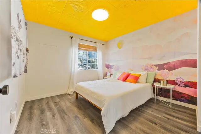 a bedroom with a bed and window